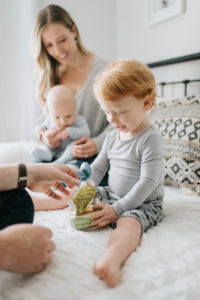 Couple and children playing in bed Couple and children playing in bed